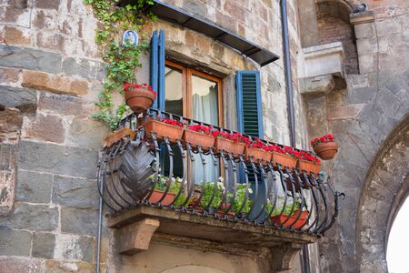 Picturesque flower decorated balcony in Medieval Town Lucca in Italy.の写真素材