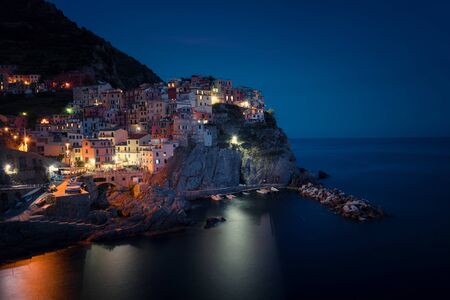 Magnificent night view of the Manarola village. Manarola is one of the five famous villages in Cinque Terre (Five lands) National Park. Liguria, Italy, Europeの写真素材