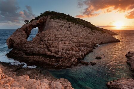 Landscape view of rocky formations Korakonisi in Zakynthos, Greece.Beautiful summer sunset, magnificent seascape.の写真素材