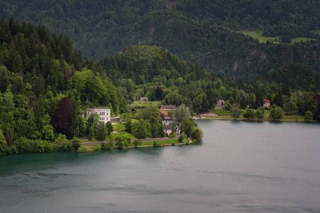 Bled Lake, shoreline mountain, alpine village in sunny weather, Slovenia, Europe.の写真素材