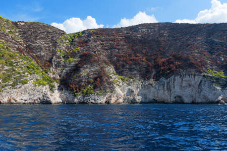 Blue Caves and blue water of Ionian sea on Island Zakynthos in Greece and sightseeing points. Rocks in clear blue seaの写真素材