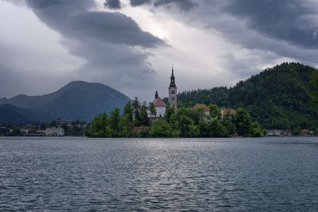 Amazing spring sunrise on Bled lake, Island, Church And Castle with Mountain Range (Stol, Vrtaca, Begunjscica) In The Background - Bled, Slovenia, Europeのeditorial素材