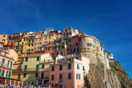 Magnificent daily view of the Manarola village in a sunny summer day. Manarola is one of the five famous villages in Cinque Terre Five lands National Park. Liguria, Italy, Europeの写真素材