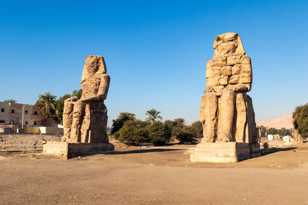 Colossi of Memnon in the Necorpole of Thebes, Egypt, Luxor. Sights in Egypt - travel, vacation,...
