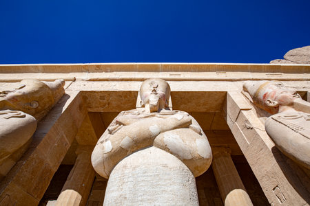 Osiris pillar in the mortuary temple of Hatshepsut in the necropolis Deir el-Bahari of Thebes, Egypt, Luxor. Sights in Egypt - travel, vacation, round tripの写真素材
