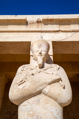 Osiris pillar in the mortuary temple of Hatshepsut in the necropolis Deir el-Bahari of Thebes, Egypt, Luxor. Sights in Egypt - travel, vacation, round tripの写真素材