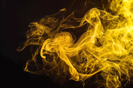 abstract yellow smoke on black backgroundの素材