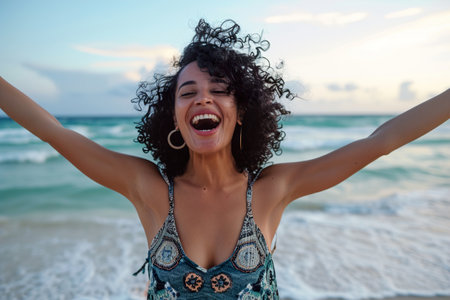 excited stylish latin hispanic woman standing at beachの素材
