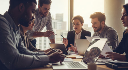 Group of young business people working and communicating together in modern office.の素材