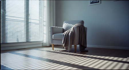 interior of living room with armchair and window with blindsの素材