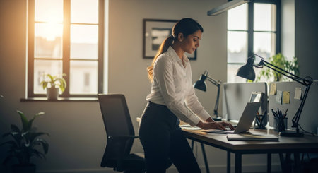 Young asian businesswoman working at her desk in the office.の素材
