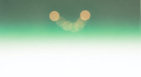 blurred bokeh lights on green background,abstract backgroundの素材