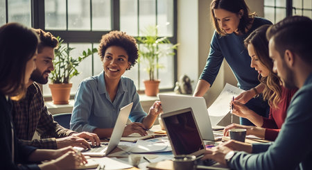 Group of young multiethnic business people working and communicating together in the office.の素材