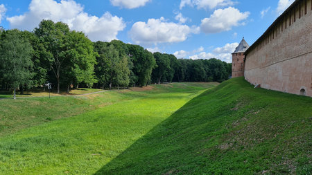 July 24, 2021, Veliky Novgorod, Russia. Majestic ancient red brick wall of the Novgorod Kremlin, a historic fortress in Veliky Novgorod, Russia.のeditorial素材