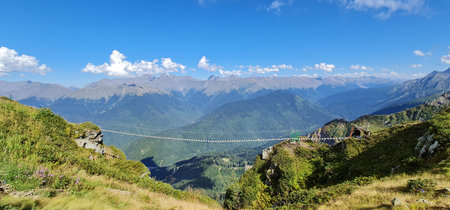 Breathtaking summer mountain landscape with suspension bridge at Rosa Khutor, Caucasus, Russia.の写真素材