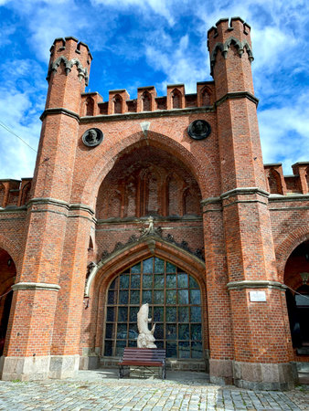 August 30, 2022, Kaliningrad, Russia. Historic red brick Rossgarten Gate in Kaliningrad under a blue skyのeditorial素材