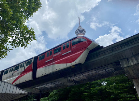 April 30, 2023, Kuala Lumpur, Malaysia. A RapidKL monorail train passes by the iconic KL Tower in...