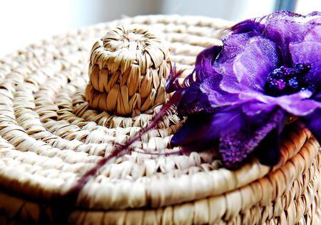 Natural rattan basket with flowerの写真素材