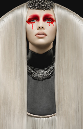 Beautiful pale woman with white hair and gothic make upの写真素材