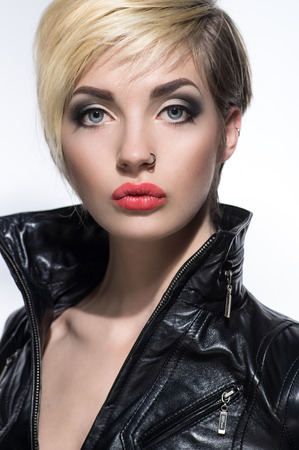Beautiful portrait of woman with short hairstyle and piercing in noseの写真素材