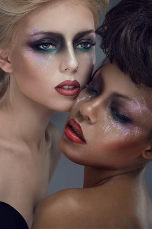 Two models with bright makeupの写真素材