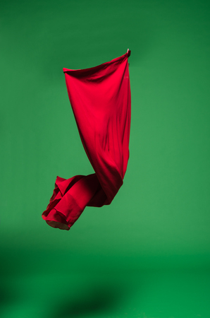 Red fabric in the airの写真素材