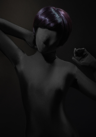 Feminine wig on woman in blackの写真素材