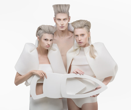 Three persons in white outfit over white backgroundの写真素材