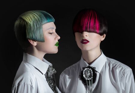 Dark portrait of pale gothic women with creatively dyed hairの写真素材