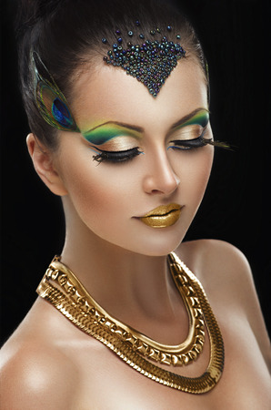 Woman with golden makeupの写真素材