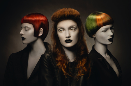 Three pale gothic women with creative hairstylesの写真素材