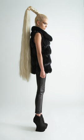 Fashion shot of a trendy girl with long hairの写真素材