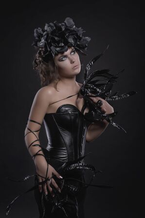 Glamour gothic fashion woman in black dressの写真素材