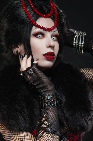 Brunette woman in gothic outfitの写真素材