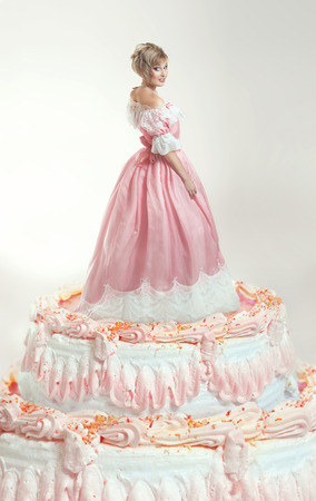 Girl and pink cakeの写真素材