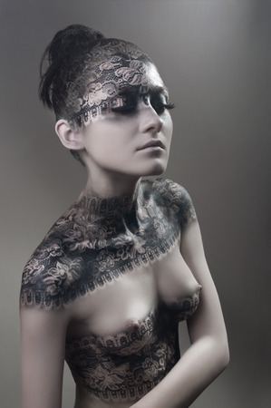 Studio portrait with body-artの写真素材