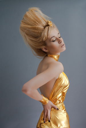 Studio portrait of young Egyptian style girl over gray backgroundの写真素材