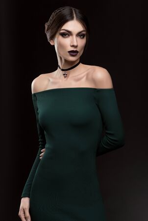 Portrait of beautiful women in fashion green dressの写真素材