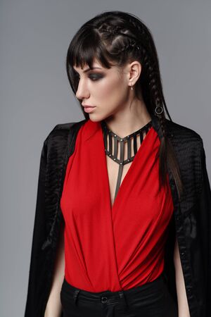 Portrait of stylish woman in fashion clothes and harnessの写真素材