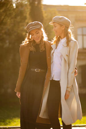 Young beautiful women posing on street in fashion clothesの写真素材