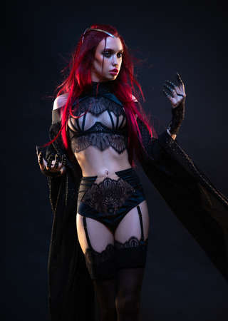 Young woman in Gothic style costume posingの写真素材