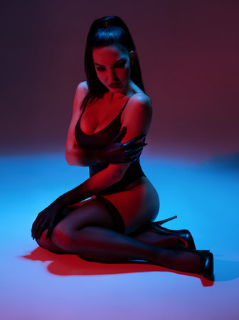 Young woman in lingerie posing in studioの写真素材