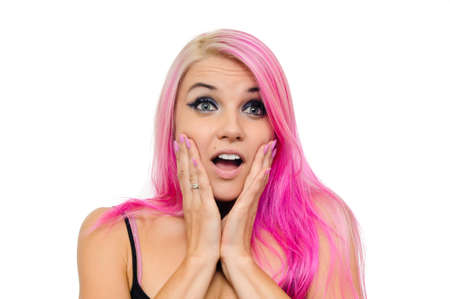 Pink haired female is surprised, touching her cheeks both hands. Mouth open.の写真素材