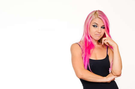 Pink hair woman looking enviously, thoughtfulの写真素材