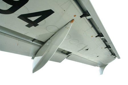 Detail of commercial airliner wing, isolated over white.