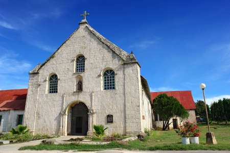 Historic Filipino coral stone Catholic parish church in Squijor City on Siquijor Island, built in 1870 near the pier and dedicated to St. Francis of Assisi.の写真素材