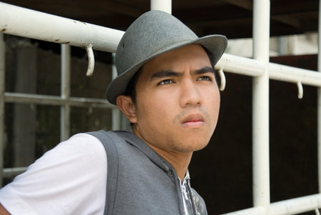 Asian man portrait with hat.