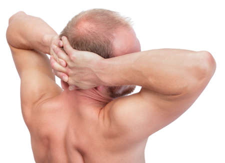 Back portrait shoulders-up of an undressed strong and muscular balding Caucasian manの写真素材