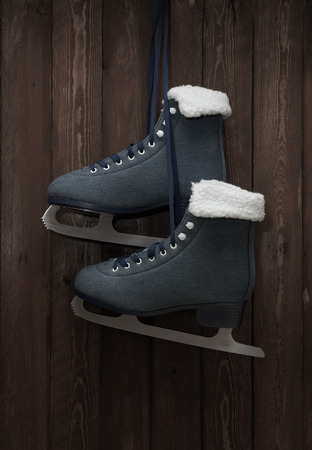 Skates hang on a wooden wallの写真素材