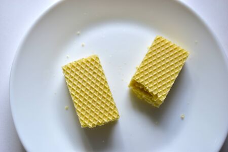 Some delicious sugar waffles on a white plateの写真素材